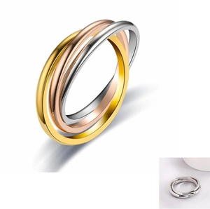 Detailed view of triple interlocking bands in gold, rose gold, and silver stainless steel
