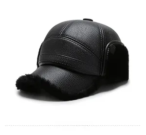 Detail of winter baseball cap featuring black leather texture and warm fleece earflaps