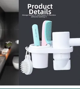 Detail view of wall-mounted hair dryer holder with storage bucket and side hooks