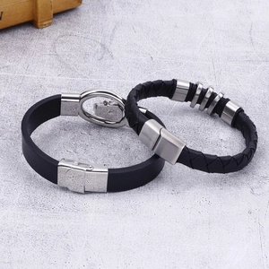 Men's trendy black braided cowhide leather bracelet featuring skull metal charms and clasp