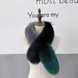 Luxurious tricolor fox fur style scarf in grey black and dark green on a mannequin
