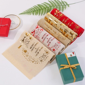 Christmas table runner rolls with festive reindeer and snowflake prints on linen texture