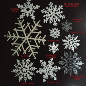 Various sizes of white and transparent plastic snowflake ornaments for Christmas decor