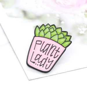 Detailed macro shot of Plant Lady enamel pin with succulent design and pink flower pot