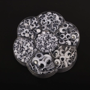 Detailed view of mixed sizes black and white googly eyes in a clear flower-shaped organizer