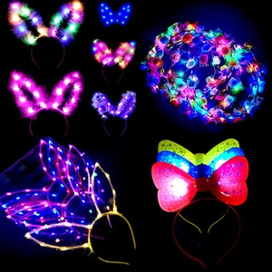 Vibrant LED light-up headbands and fairy wings set for party costumes on black background