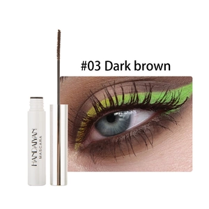 Detail view of dark brown mascara showing wand brush and applied long lashes effect