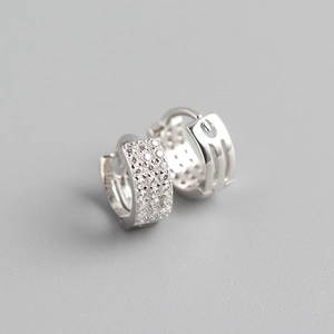Close-up of wide S925 sterling silver hoop earrings with triple row micro-pave zircons