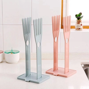 Foldable plastic drying rack for kitchen towels and gloves with drip tray in blue and pink