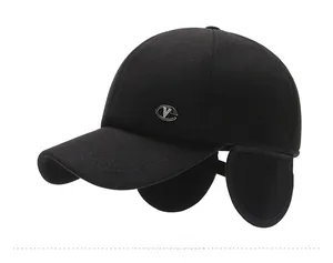 Side view of men's winter baseball cap with ear flaps and metal logo detail