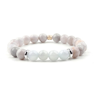 Dettaglio di bracciale con pietre di luna pastello e distanziatore in oro rosa