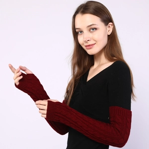 Detail of cable knit pattern on long burgundy fingerless gloves for women