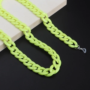 Detail of neon green acrylic chain eyewear strap with metal loops and silicone loops