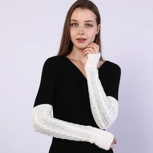 Detailed cable knit pattern on off-white long fingerless gloves for women
