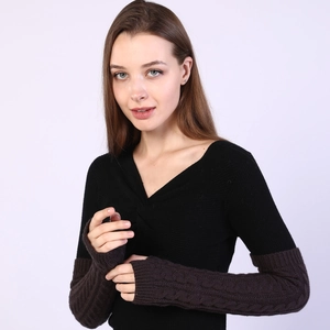 Macro detail of dark brown cable-knit arm warmers with fingerless design for winter
