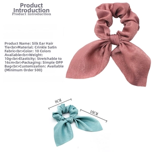Detailed view of satin bunny ear scrunchies showing texture and 16cm stretch size