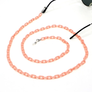 Detailed close-up of pink acrylic eyewear chain with silver lobster clasps and rubber loops
