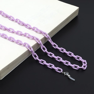 Close-up of light purple acrylic glasses chain with lobster clasp and silicone rings