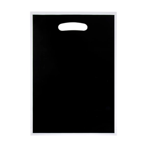 Single black pearlescent gift bag with die-cut handles for party favors on white background
