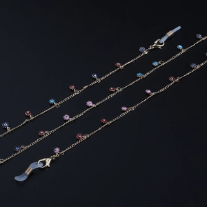 Golden eyewear chain with colorful evil eye charms and secure silicone loops