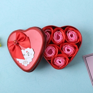 Red heart-shaped tin gift box with 6 pink soap roses and a red satin ribbon bow