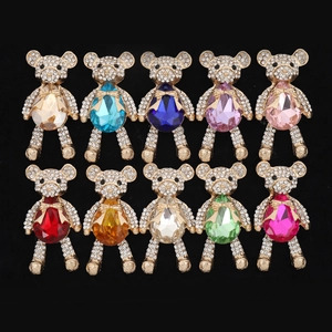 Detail of ten colorful bear jewelry accessories with rhinestones and teardrop stones