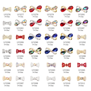 Bow-tie metal nail art charms set with crystals and pearls in assorted colors