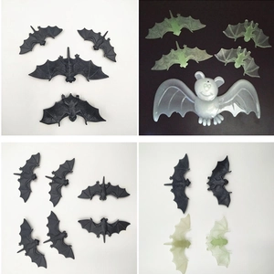 Detailed views of realistic black and glow-in-the-dark plastic bats for Halloween props