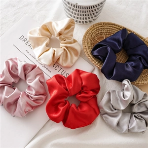 Set of 5 elegant satin hair scrunchies in champagne pink and navy colors for women