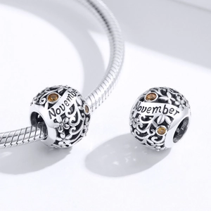 S925 sterling silver November birthstone charm with floral cutout and amber gems