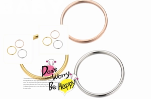 Detailed view of minimalist 1mm stainless steel rings in gold, rose gold, and silver finishes