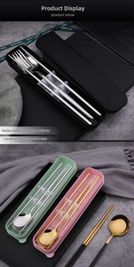 Close-up of portable stainless steel cutlery set with spoons, forks and colorful storage cases