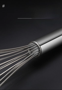Detail showing the reinforced wire interface on the stainless steel whisk for durability