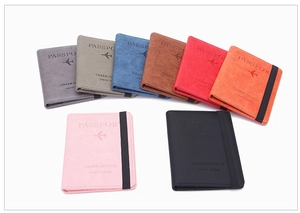 Detailed display of slim RFID passport holders in eight vibrant matte PU leather colors