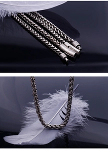 Macro detail of retro oxidized titanium steel foxtail chain with cylindrical clasp