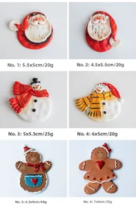 Detail view of 3D resin Santa and Snowman fridge magnets with dimensions and labels
