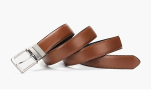 Detailed view of a brown leather belt featuring a silver metal pin buckle and fine stitching