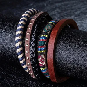 Detailed close-up of multilayer leather and wood bead bracelets with ethnic woven patterns