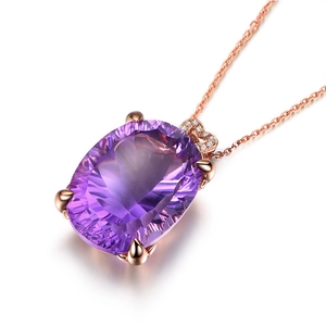 Rose gold necklace featuring an oval purple amethyst pendant and heart-shaped diamond bail