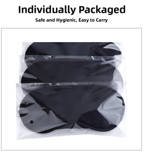 Three-piece set of black sleep masks in individual hygienic plastic packaging