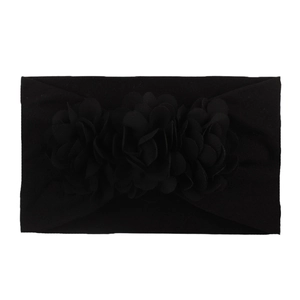 Soft black nylon headband for babies featuring three handcrafted chiffon flowers