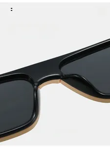 Detail view of square sunglasses featuring comfortable integrated nose pads and sleek frame