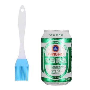 Silicone basting brush with blue head and white handle shown next to a can for scale