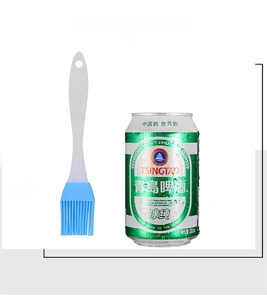 Size comparison of a blue silicone basting brush next to a standard beer can