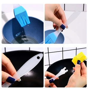 Detail of detachable silicone brush heads for baking with ergonomic grip and hanging hole