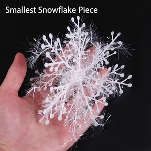 Small 3D white snowflake decoration with colorful laser fibers shown in palm