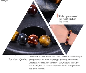 Macro shot of multi-colored tiger eye stone beads showing natural cat-eye light effect
