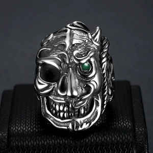 Vintage stainless steel skull ring for men with green gemstone and punk style details