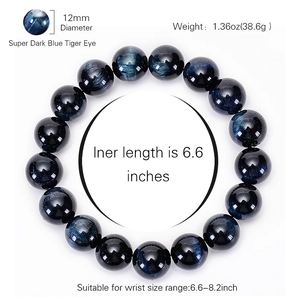 Natural 12mm deep blue tiger eye stone bracelet with smooth polished beads on white background