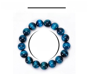 Macro detail of 12mm blue tiger eye stone beads showing natural texture and smooth finish